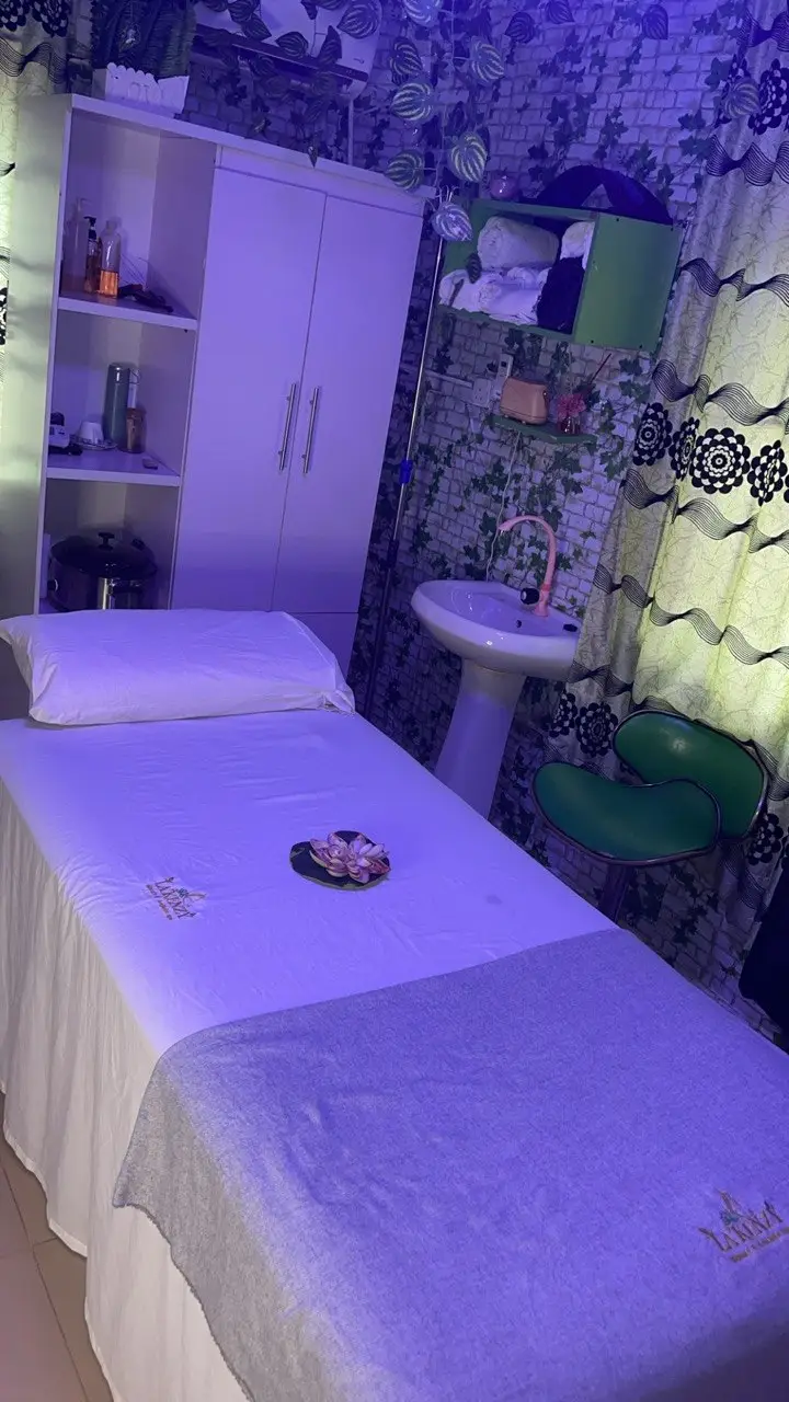 Massage treatment room at La'kenzy Skincare & Aesthetic SPA in Mowe Ogun State with a prepared treatment bed, towels, and spa equipment.